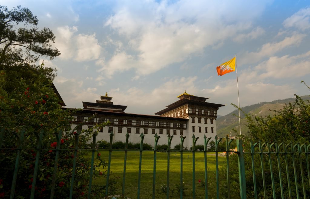 Tashichho Dzong in Thimpu with bhutanese flag (Bhutan)